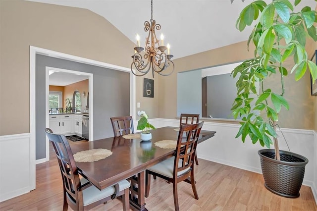 1331 Red Hill Rd, Marietta, GA 30008 - dining area featuring light wood-style floors, vaulted ceiling, and a chandelier