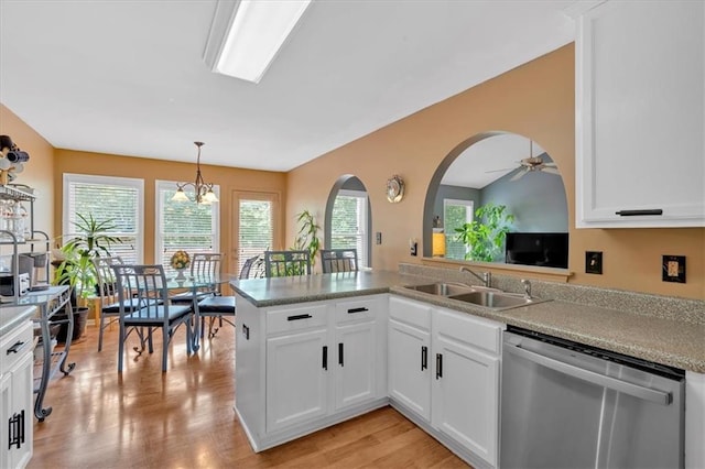 1331 Red Hill Rd, Marietta, GA 30008 - kitchen with stainless steel dishwasher, white cabinetry, a ceiling fan, and decorative light fixtures