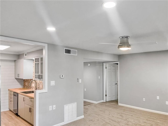 475 Mount Vernon Hwy NE Unit 226C, Atlanta, GA 30328 - kitchen featuring dishwasher, backsplash, recessed lighting, light colored carpet, and glass insert cabinets