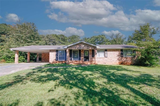 ranch-style home with a carport, covered porch, and a front lawn