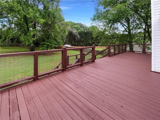wooden terrace with a lawn
