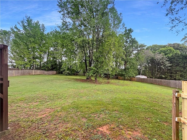 view of yard with a fenced backyard