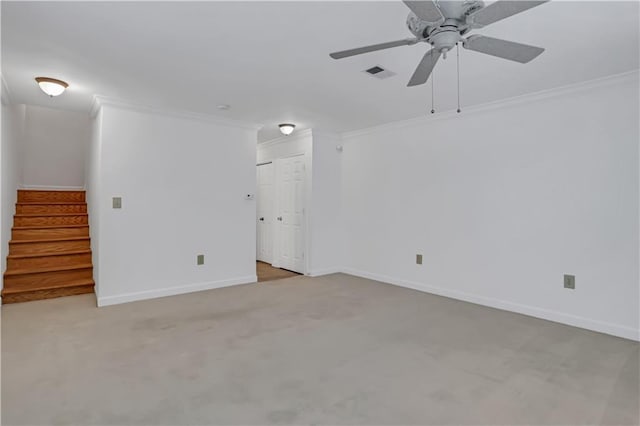empty room with light colored carpet, ornamental molding, visible vents, stairway, and baseboards