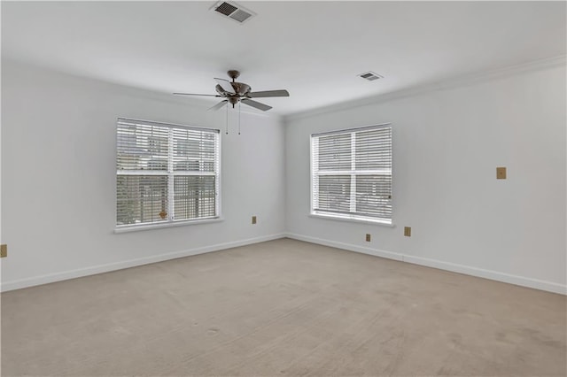 spare room with visible vents, baseboards, and ceiling fan
