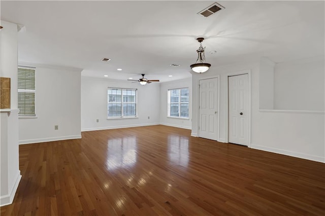 unfurnished living room featuring ceiling fan, baseboards, visible vents, and hardwood / wood-style flooring