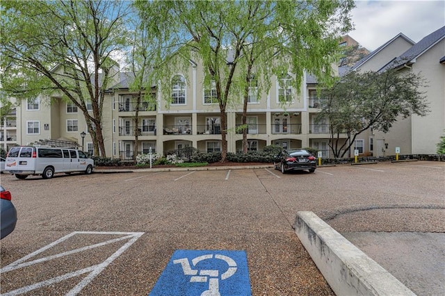 view of property with uncovered parking
