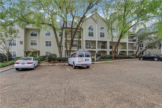 view of property with uncovered parking