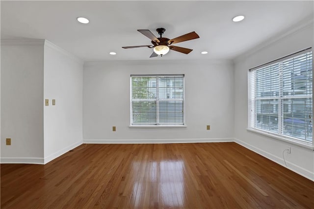 empty room featuring baseboards, a ceiling fan, crown molding, recessed lighting, and wood finished floors