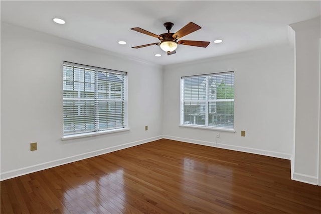 spare room with baseboards, recessed lighting, wood finished floors, and a ceiling fan
