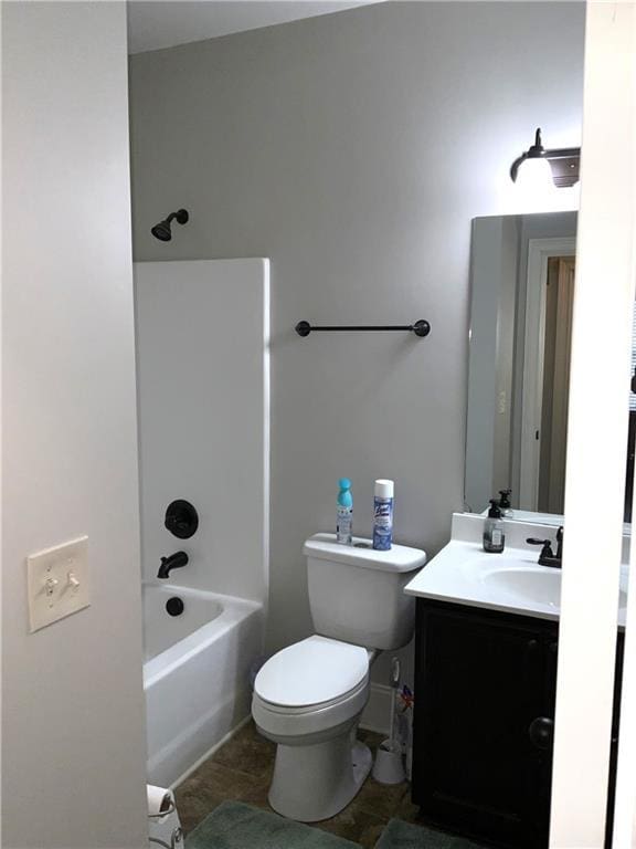 full bath featuring shower / bath combination, vanity, and toilet