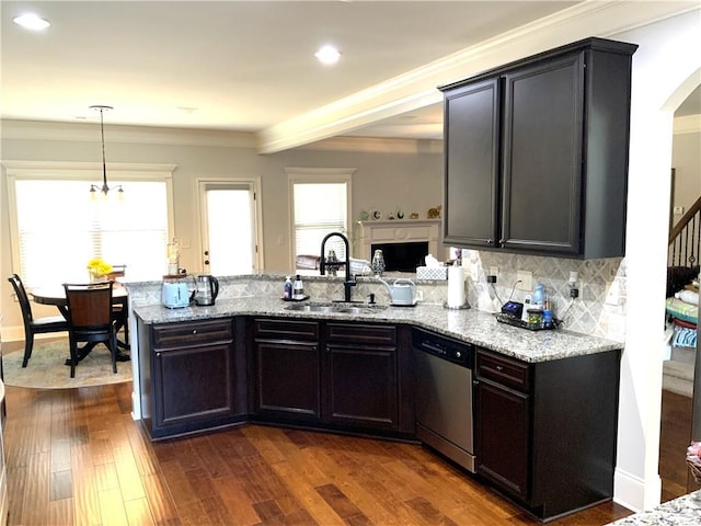 kitchen featuring a sink, stainless steel dishwasher, light stone countertops, dark wood-style floors, and tasteful backsplash