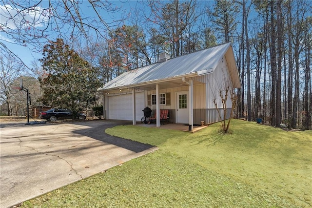 exterior space featuring driveway and an attached garage