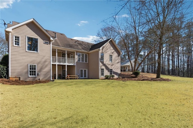 rear view of house with a yard