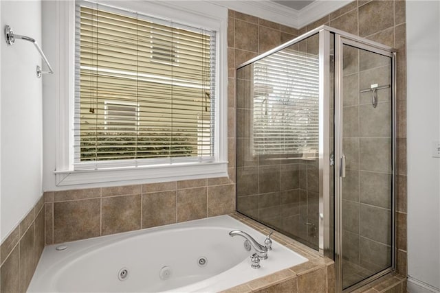 full bathroom with a tub with jets, a stall shower, and ornamental molding