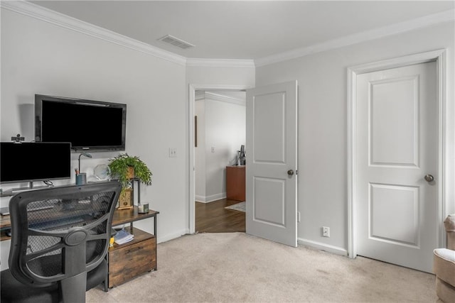 office with visible vents, baseboards, crown molding, and carpet