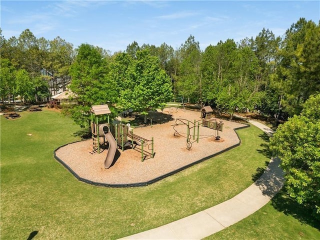 communal playground featuring a lawn