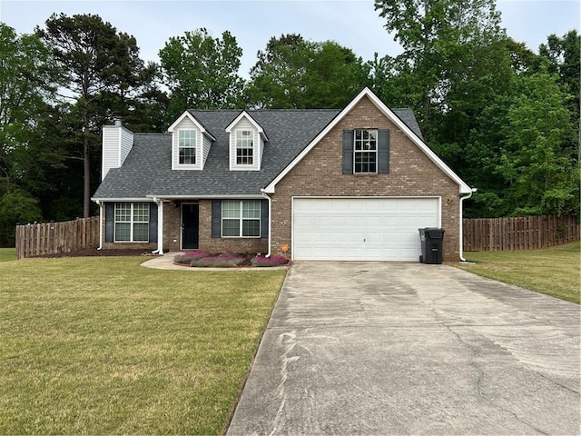 view of front facade with concrete driveway, a front lawn, fence, and brick siding