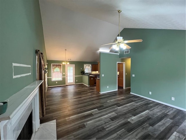 unfurnished living room featuring dark wood-style floors, a ceiling fan, baseboards, a fireplace, and high vaulted ceiling