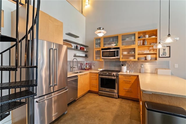 170 Boulevard Se E120, Atlanta, GA 30312 - kitchen with high end appliances, open shelves, a peninsula, concrete flooring, and backsplash