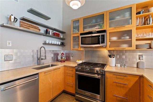 170 Boulevard Se E120, Atlanta, GA 30312 - kitchen featuring stainless steel appliances, open shelves, backsplash, and light countertops