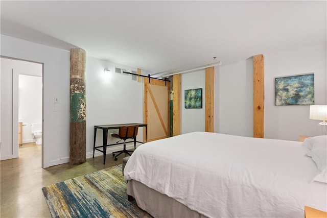 170 Boulevard Se E120, Atlanta, GA 30312 - bedroom featuring a barn door and finished concrete floors