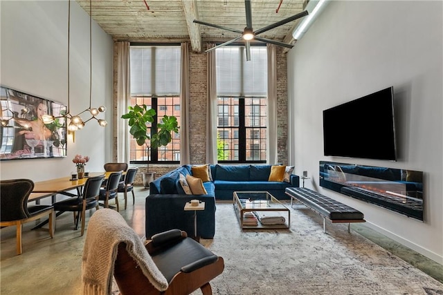 170 Boulevard Se E120, Atlanta, GA 30312 - living room with a high ceiling, finished concrete floors, wood ceiling, and a ceiling fan