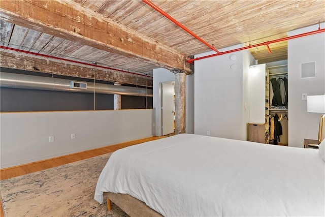 170 Boulevard Se E120, Atlanta, GA 30312 - bedroom featuring wood finished floors, a walk in closet, and a closet