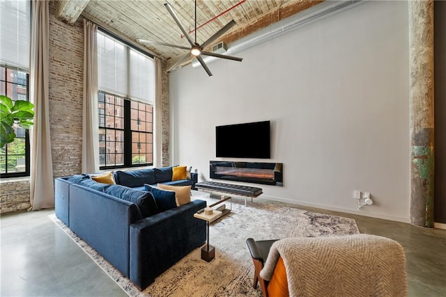 170 Boulevard Se E120, Atlanta, GA 30312 - living area with a high ceiling, concrete flooring, healthy amount of natural light, and a ceiling fan