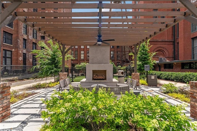 170 Boulevard Se E120, Atlanta, GA 30312 - view of patio featuring a fireplace, a ceiling fan, and a pergola