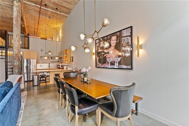 170 Boulevard Se E120, Atlanta, GA 30312 - dining area with wood ceiling, a high ceiling, and finished concrete flooring
