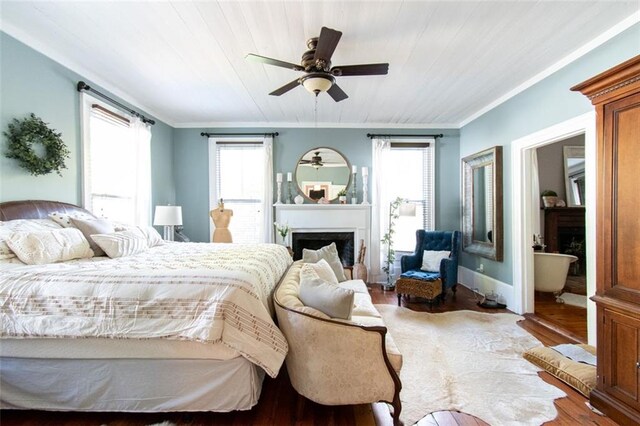 bedroom with wood ceiling, ceiling fan, hardwood / wood-style floors, and crown molding