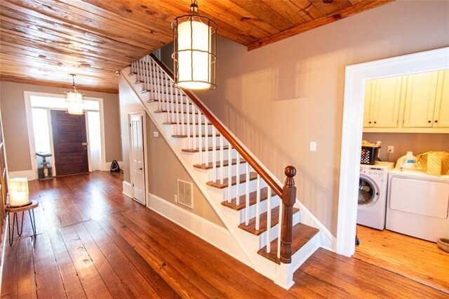 interior space with wooden ceiling, hardwood / wood-style flooring, and separate washer and dryer