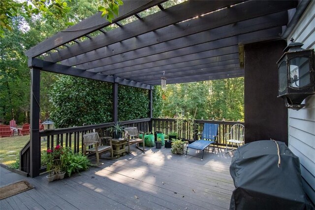 deck featuring area for grilling and a pergola