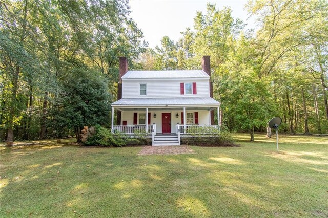 view of front facade with a porch and a front yard