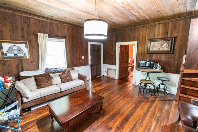 living room featuring wooden ceiling, wooden walls, and dark hardwood / wood-style floors