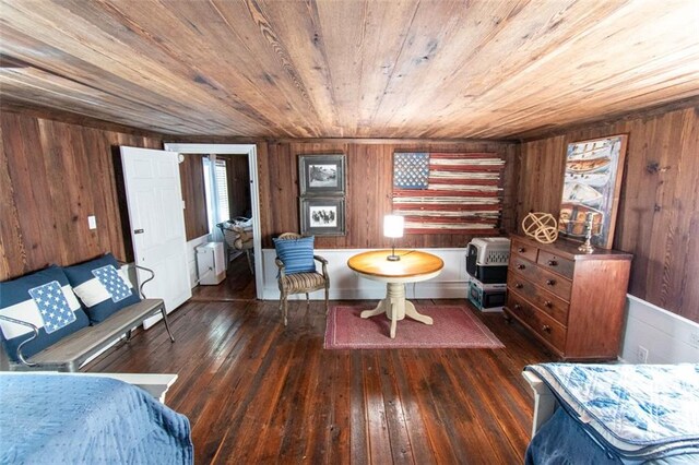 living area with wooden ceiling, wood walls, dark hardwood / wood-style floors, and radiator