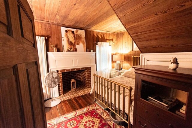 view of sauna featuring wood ceiling, wood walls, and hardwood / wood-style floors