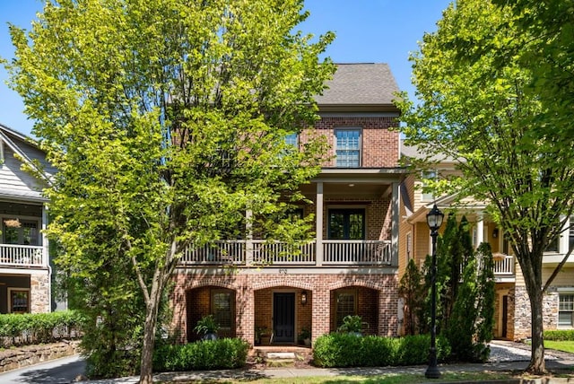 970 N Ormewood Park Dr SE, Atlanta, GA 30316 - view of front facade with a balcony and brick siding
