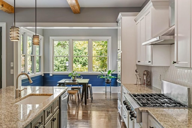 970 N Ormewood Park Dr SE, Atlanta, GA 30316 - kitchen featuring appliances with stainless steel finishes, a sink, dark wood finished floors, white cabinetry, and beamed ceiling