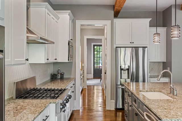 970 N Ormewood Park Dr SE, Atlanta, GA 30316 - kitchen featuring a sink, appliances with stainless steel finishes, dark wood finished floors, decorative backsplash, and white cabinets