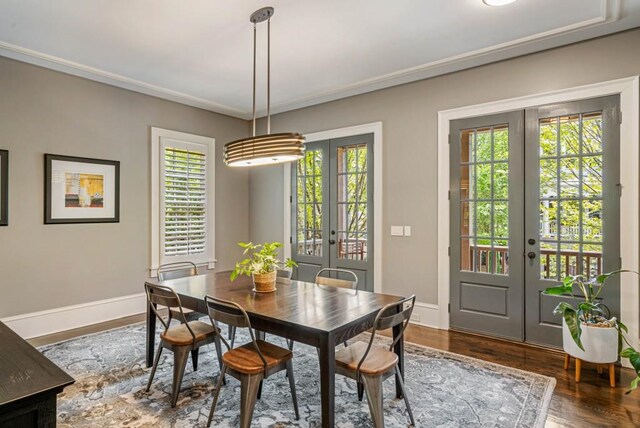 970 N Ormewood Park Dr SE, Atlanta, GA 30316 - dining area featuring french doors, healthy amount of natural light, baseboards, wood finished floors, and ornamental molding