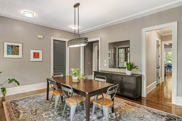 970 N Ormewood Park Dr SE, Atlanta, GA 30316 - dining room featuring wood finished floors, baseboards, and crown molding