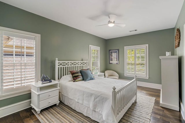 970 N Ormewood Park Dr SE, Atlanta, GA 30316 - bedroom with dark wood finished floors, baseboards, and a ceiling fan