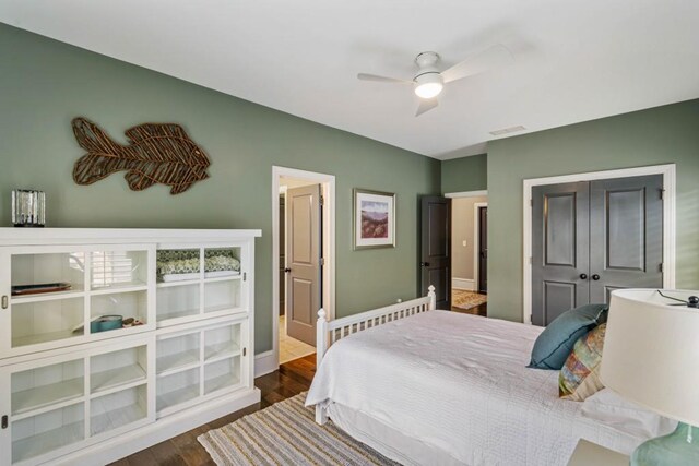 970 N Ormewood Park Dr SE, Atlanta, GA 30316 - bedroom with dark wood-type flooring, a closet, baseboards, and a ceiling fan