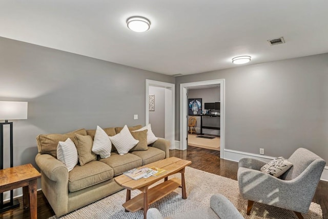 970 N Ormewood Park Dr SE, Atlanta, GA 30316 - living room featuring dark wood finished floors and baseboards