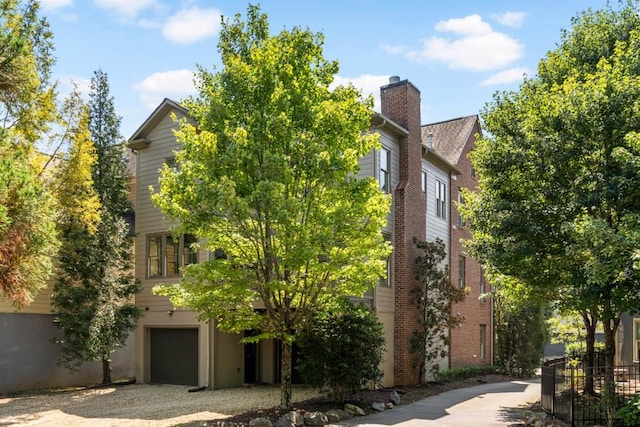 970 N Ormewood Park Dr SE, Atlanta, GA 30316 - view of front of home with a garage and gravel driveway