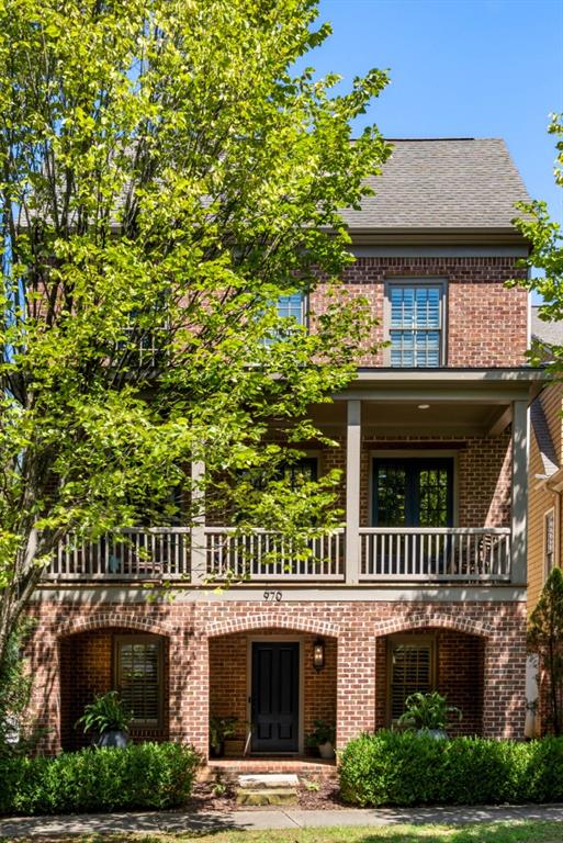 970 N Ormewood Park Dr SE, Atlanta, GA 30316 - view of front of house with a balcony and brick siding