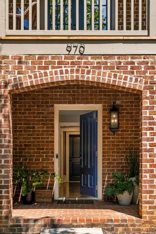 970 N Ormewood Park Dr SE, Atlanta, GA 30316 - view of exterior entry featuring brick siding and a balcony