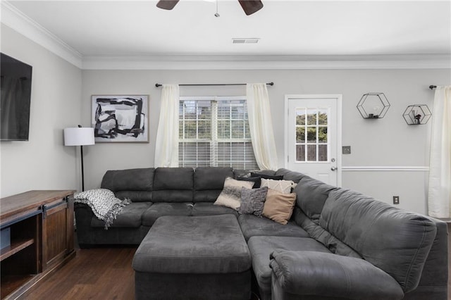 living room with crown molding, ceiling fan, and dark hardwood / wood-style flooring