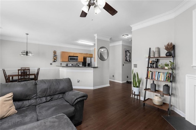 living room featuring crown molding, dark hardwood / wood-style floors, and ceiling fan with notable chandelier